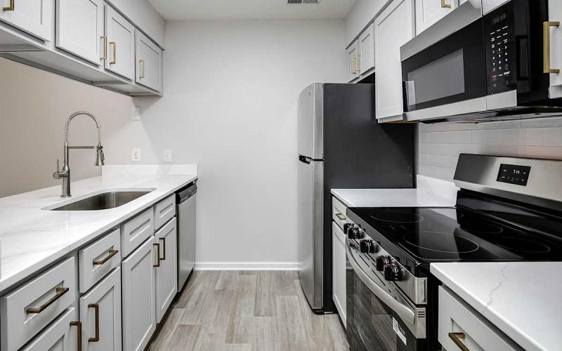 a kitchen with white cabinets