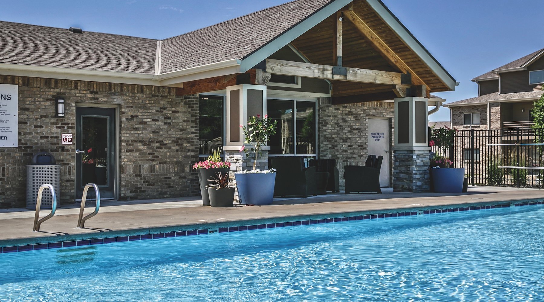 a swimming pool in front of a building
